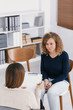 Woman with problem and supporting counselor during therapy session