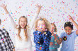 © Photographee.eu - Happy multicultural group of kids with colorful confetti during birthday party