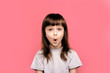 © Marharyta Hanhalo - Wow! Surprise and shock. It's amazing news. Little child girl showing overjoy emotions over pink studio background. Human emotions, lifestyle, freestyle, smile, blank, funny gesture.