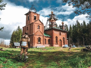 man and old church in russia