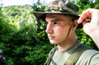© Miljan Živković - Special force military soldier portrait wearing hat in battle zone
