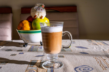 cup of tea with oranges, apples and sheets