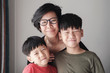 Smiling Mother and sons at home, Happy Asian family portrait