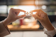 © aFotostock - Implement improve puzzel solve connections together with synergy strategy team building organizing connection by trust communication. Hands of stakeholders business trust team holding jigsaw puzzle