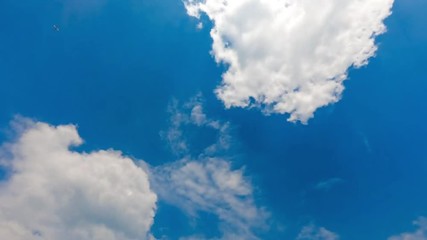 Wall Mural - Time lapse of white clouds with blue sky in background