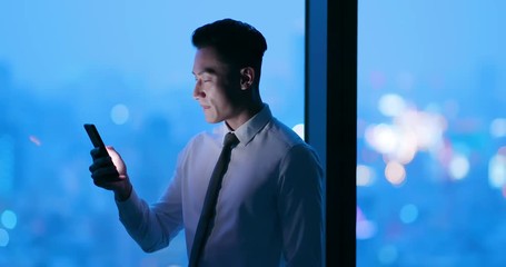 man use smartphone at night