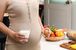 Young woman asian choose eating healthy food,eggs and milk during her pregnancy.