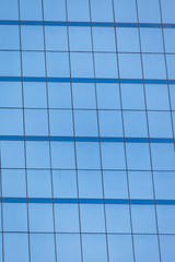 Blue glass windows of office building