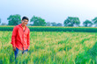 © PRASANNAPIX - Young indian farmer at field