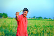 © PRASANNAPIX - Young indian farmer at field