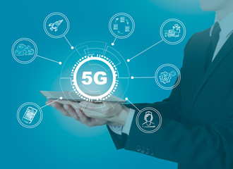 Wall Mural - 5g network, high-speed mobile internet. science, education, business and health concept. man holding