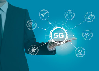 Wall Mural - 5g network, high-speed mobile internet. science, education, business and health concept. man holding