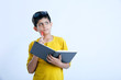 © PRASANNAPIX - Young indian cute boy with notebook , thinking expression