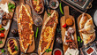 Traditional Turkish cuisine. Pizza, pita, pidesi, sucuk, hummus, kebab, bulgar. Many dishes on the table. Serving dishes in restaurant. Background image. Top view, flat lay