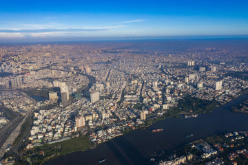 Top View of Building in a City - Aerial view Skyscrapers flying by drone of Ho Chi Mi City with development buildings, transportation, energy power infrastructure. include Landmark 81 building 