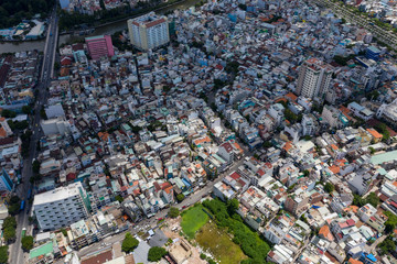 Top View of Building in a City - Aerial view Skyscrapers flying by drone of Ho Chi Mi City with development buildings, transportation, energy power infrastructure. include Landmark 81 building 