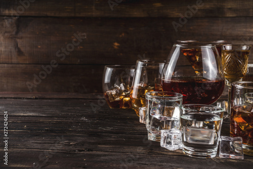 Cuadros en Lienzo Assortment various hard and strong alcoholic drinks in different glasses: vodka, cognac, tequila, brandy and whiskey, grappa, liqueur, vermouth, tincture, rum, etc