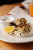 Fototapeta Mapy - Cutlets with steamed rice on a white dish for a nutritious lunch out
