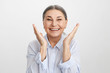 © shurkin_son - Positive vibrations and human emotions. Pleased ecstatic lucky elderly Caucasian female in blue shirt expressing excitement and joy, smiling broadly, rejoicing at success, victory or life goals