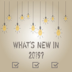 Writing note showing What S New In 2019. Business concept for Year resolution Goals Career achievements Technology