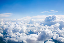 White Clouds On Blue Sky Background Close Up, Cumulus Clouds High In Azure Skies, Beautiful Aerial Cloudscape View From Above, Sunny Heaven Landscape, Bright Cloudy Sky View From Airplane, Copy Space