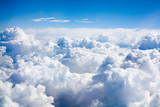 Fototapeta Konie - White clouds on blue sky background close up, cumulus clouds high in azure skies, beautiful aerial cloudscape view from above, sunny heaven landscape, bright cloudy sky view from airplane, copy space