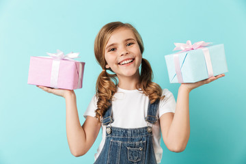 Wall Mural - Portrait of a cheerful little girl isolated