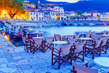 Greece, Europe - Scenic Twilight Scenery Of Street Cafe In Ancient Greek Harbor Nafpaktos. Nafpaktos Was Important Part Of Ancient Greece.  Nowdays Nafpaktos Is Popular Travel Destination In Greece.
