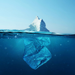 Wall Mural - iceberg with bottle in the ocean underwater. environmental pollution. plastic water bottles pollute 