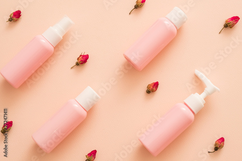 Download Rose Essential Oil Natural Cosmetic Products Travel Kit Mockup Plastic Bottles Floral Pattern Peach Background Stock Photo Adobe Stock