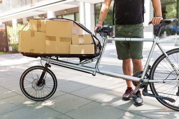 Sticker - Bicycle messenger making a delivery on a cargo bike