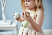 Child Decorating An Easter Tree