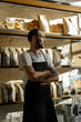 © Milles Studio/Stocksy - Confident barista standing inside of coffee house
