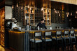 © Milles Studio/Stocksy - Bartender working in elegant contemporary bar