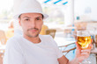 © travnikovstudio - Young man with beer on the beach in outdoors bar