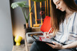 © Boris Jovanovic/Stocksy - Brunette woman drawing on a tablet in the offce
