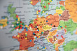 © Natalie JEFFCOTT/Stocksy - Close up of map of Europe with pins showing visitor locations