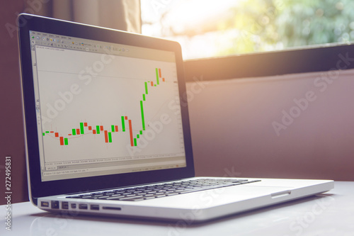 Stock Trading Forex On Laptop On A White Table Buy This Stock - 