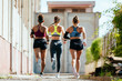 © Bonninstudio/Stocksy - Group of professional runners.