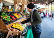 © Jodie Johnson/Stocksy - Man food shopping at a market