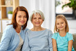 © Syda Productions - family, generation and female concept - portrait of smiling mother, daughter and grandmother at home