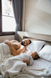 © Diane Durongpisitkul/Stocksy - Father and Baby in Bed