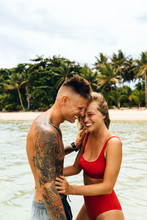 Portrait Of Happy Couple On The Beach