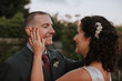 © Leah Flores/Stocksy - Affectionate Bride and Groom Looking at each Other