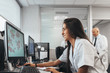 © MyMicrostock/Stocksy - Young woman working with a computer in the laboratory