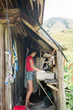 © L?a Jones/Stocksy - teen doing dishes in a shepherd's hut in the  French alps.