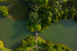 © Felix Hug/Stocksy - A bridge in a park