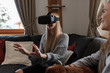 © Milles Studio/Stocksy - Excited woman touching air in VR headset