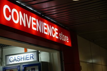 Convenience Store And Cashier Sign On Airport Terminal