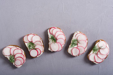 Wall Mural - Healthy vegetable toasts sandwith with radish and dill